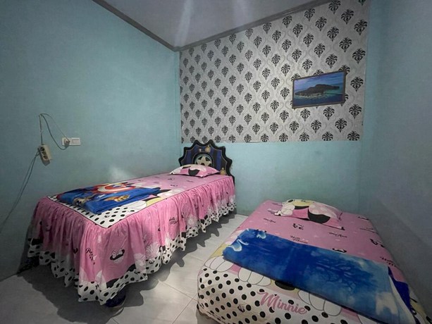 Imagen de la habitación del Hotel OYO 93308 Lima Saudara Syariah. Foto 6