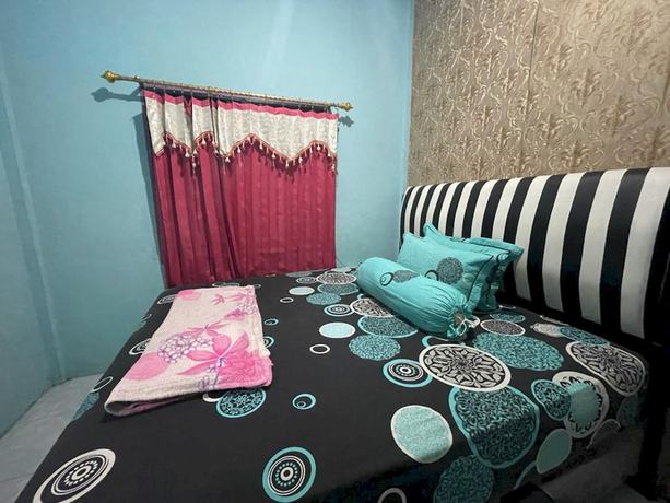 Imagen de la habitación del Hotel OYO 93308 Lima Saudara Syariah. Foto 7