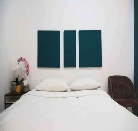 Imagen de la habitación del Hotel OYO 93311 Pesona Orange Homestay. Foto 10