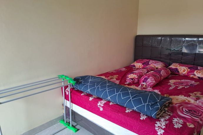 Imagen de la habitación del Hotel OYO 93320 Venus Homestay Syariah. Foto 7