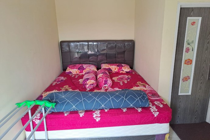 Imagen de la habitación del Hotel OYO 93320 Venus Homestay Syariah. Foto 8