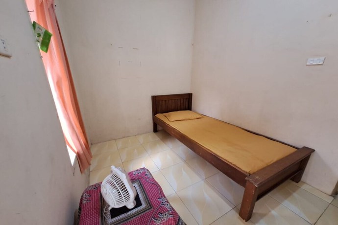 Imagen de la habitación del Hotel OYO 93320 Venus Homestay Syariah. Foto 9