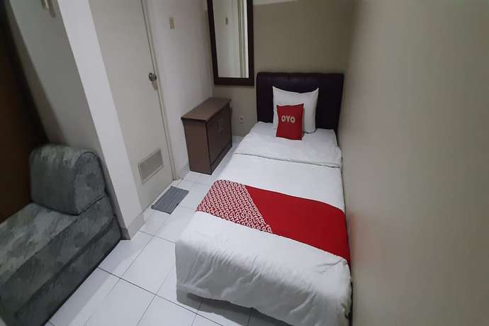 Imagen de la habitación del Hotel OYO 93358 Sukamulya Homestay. Foto 12