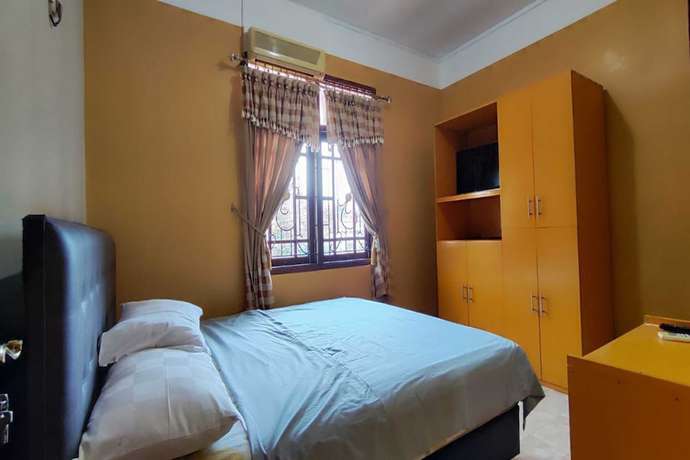 Imagen de la habitación del Hotel OYO 93390 Griya Pius Syariah Malioboro. Foto 6