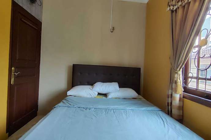 Imagen de la habitación del Hotel OYO 93390 Griya Pius Syariah Malioboro. Foto 10