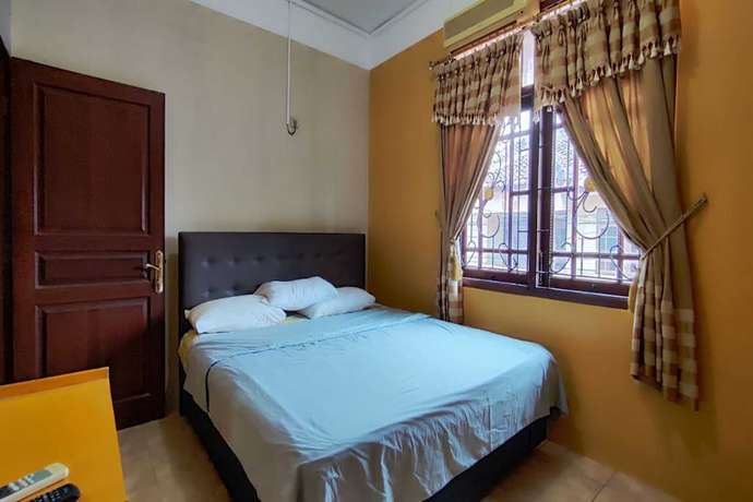 Imagen de la habitación del Hotel OYO 93390 Griya Pius Syariah Malioboro. Foto 12