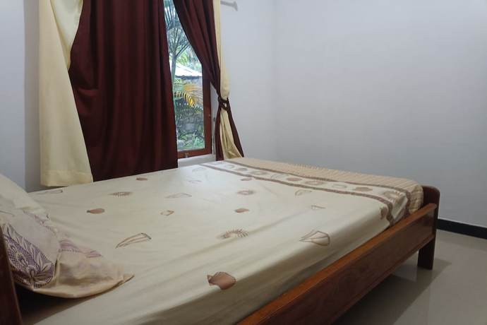 Imagen de la habitación del Hotel OYO 93408 Penginapan Annisya. Foto 6