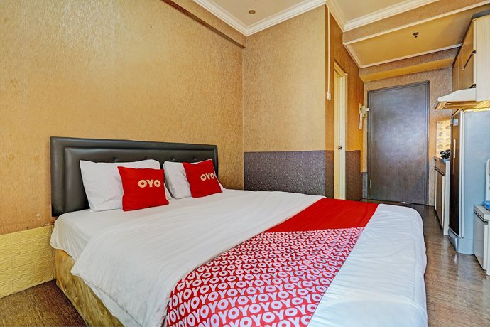 Imagen de la habitación del Hotel OYO 93426 Metro Suites By Goodvibes. Foto 15