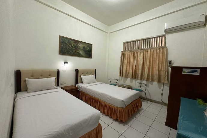 Imagen de la habitación del Hotel OYO 93467 Wisma Olo Syariah. Foto 2