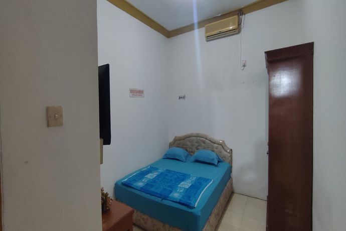 Imagen de la habitación del Hotel OYO 93467 Wisma Olo Syariah. Foto 3