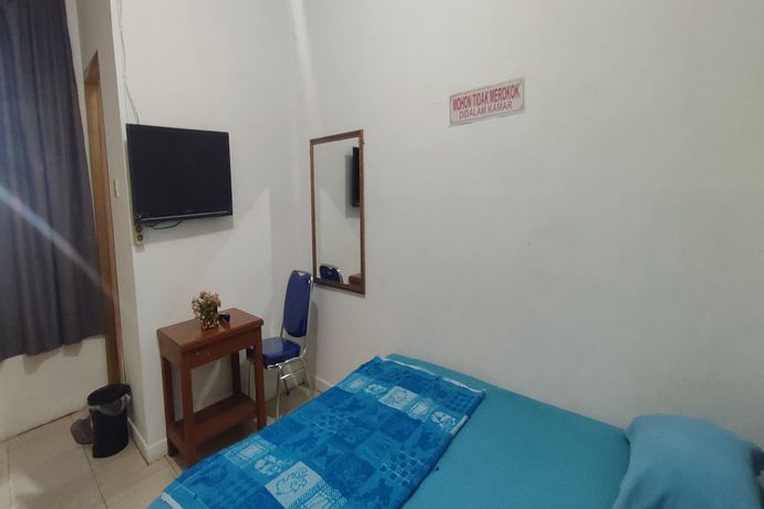 Imagen de la habitación del Hotel OYO 93467 Wisma Olo Syariah. Foto 4