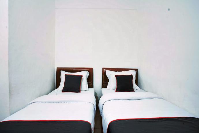 Imagen de la habitación del Hotel OYO 93467 Wisma Olo Syariah. Foto 5