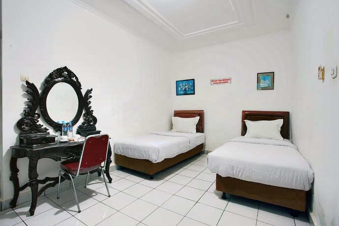 Imagen de la habitación del Hotel OYO 93467 Wisma Olo Syariah. Foto 6