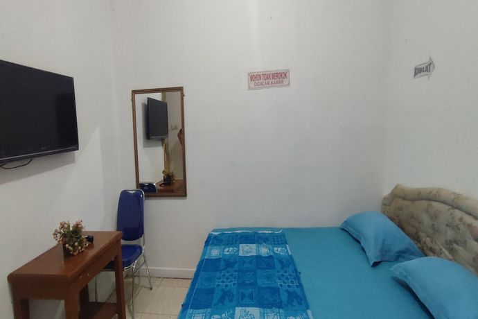Imagen de la habitación del Hotel OYO 93467 Wisma Olo Syariah. Foto 9