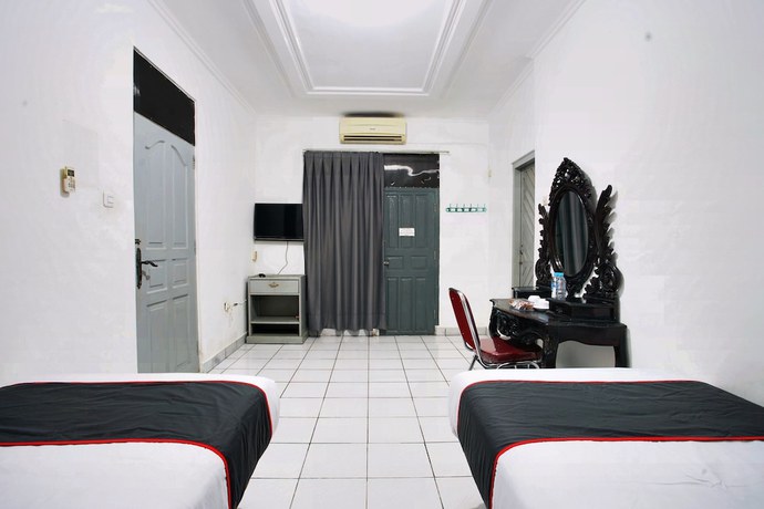 Imagen de la habitación del Hotel OYO 93467 Wisma Olo Syariah. Foto 10