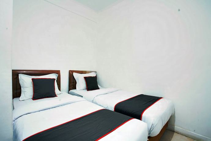 Imagen de la habitación del Hotel OYO 93467 Wisma Olo Syariah. Foto 11