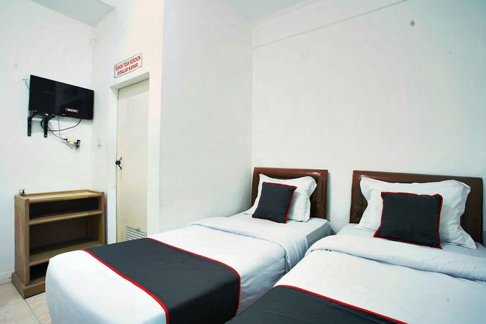 Imagen de la habitación del Hotel OYO 93467 Wisma Olo Syariah. Foto 12