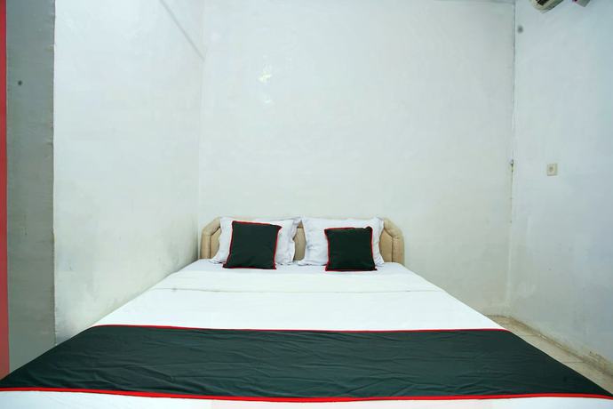 Imagen de la habitación del Hotel OYO 93467 Wisma Olo Syariah. Foto 13