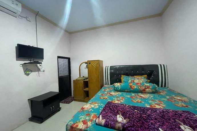 Imagen de la habitación del Hotel OYO 93467 Wisma Olo Syariah. Foto 14