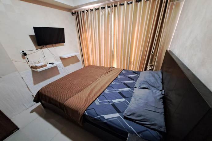 Imagen de la habitación del Hotel OYO 93481 Apartement Grand Asia Afrika. Foto 3