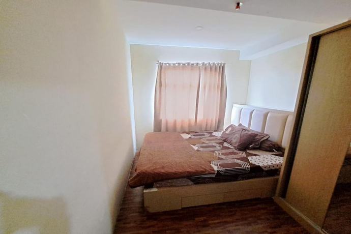 Imagen de la habitación del Hotel OYO 93481 Apartement Grand Asia Afrika. Foto 10