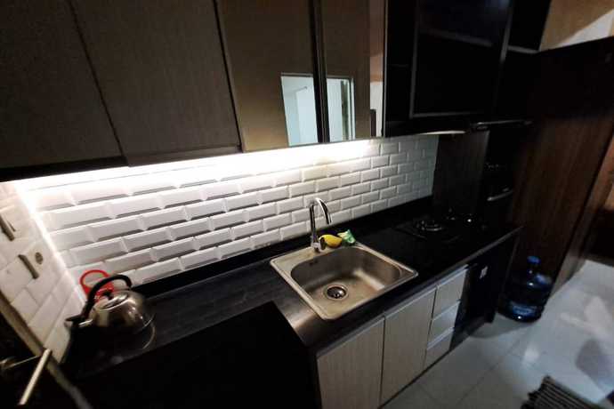 Imagen de la habitación del Hotel OYO 93481 Apartement Grand Asia Afrika. Foto 13
