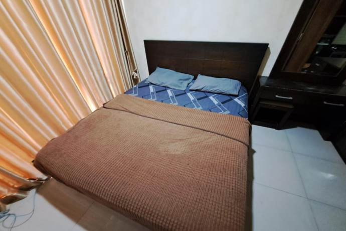 Imagen de la habitación del Hotel OYO 93481 Apartement Grand Asia Afrika. Foto 14