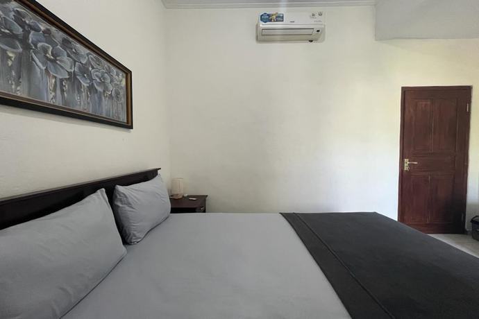 Imagen de la habitación del Hotel OYO 93482 Penginapan Tenang Lovina. Foto 8
