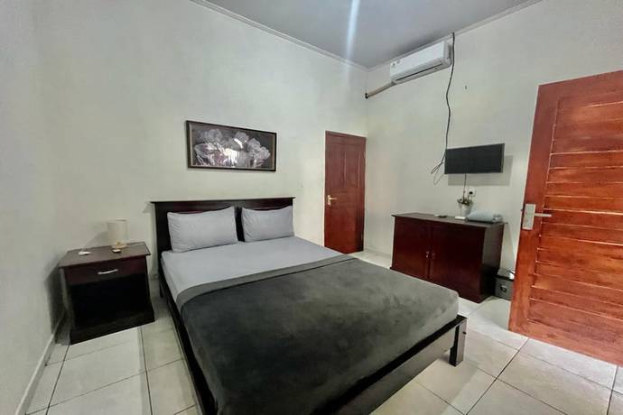 Imagen de la habitación del Hotel OYO 93482 Penginapan Tenang Lovina. Foto 12