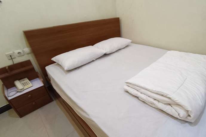 Imagen de la habitación del Hotel OYO 93507 Saril Riverside Homestay. Foto 1