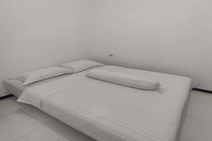 Imagen de la habitación del Hotel OYO 93526 Homely Syariah. Foto 6