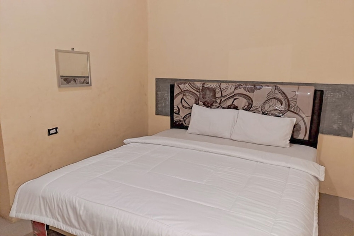 Imagen de la habitación del Hotel OYO 93590 Penginapan Palapa 10. Foto 2