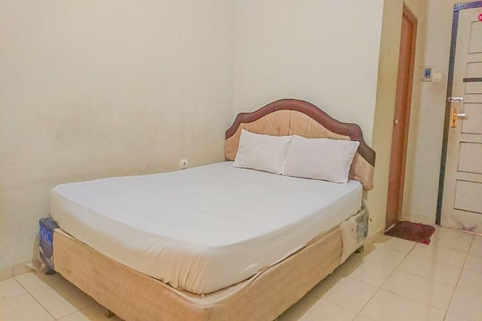 Imagen de la habitación del Hotel OYO 93590 Penginapan Palapa 10. Foto 9