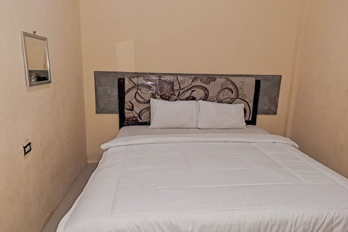 Imagen de la habitación del Hotel OYO 93590 Penginapan Palapa 10. Foto 10