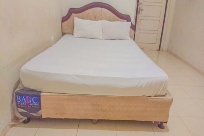 Imagen de la habitación del Hotel OYO 93590 Penginapan Palapa 10. Foto 11