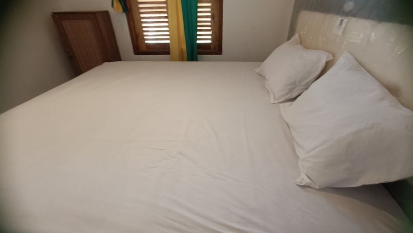 Imagen de la habitación del Hotel OYO 93626 Hi Homestay and Group. Foto 6