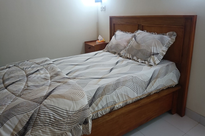 Imagen de la habitación del Hotel OYO 93627 Avocado Homestay. Foto 2