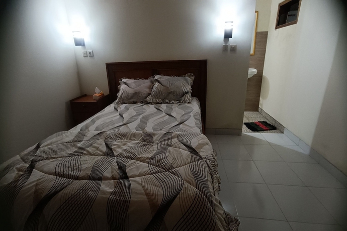 Imagen de la habitación del Hotel OYO 93627 Avocado Homestay. Foto 3