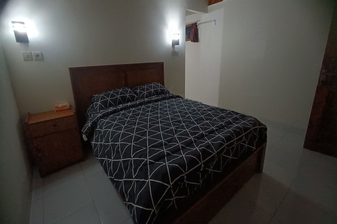 Imagen de la habitación del Hotel OYO 93627 Avocado Homestay. Foto 6