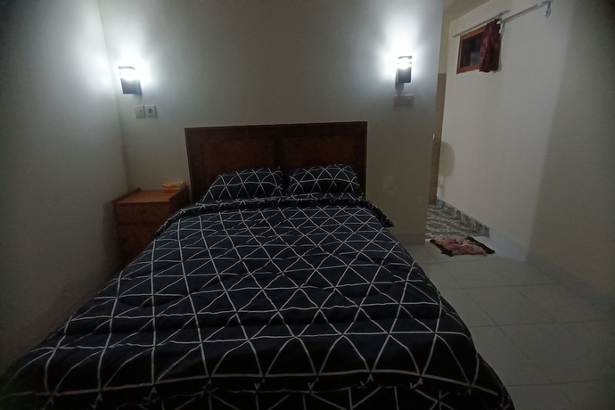 Imagen de la habitación del Hotel OYO 93627 Avocado Homestay. Foto 8