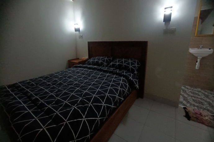 Imagen de la habitación del Hotel OYO 93627 Avocado Homestay. Foto 9