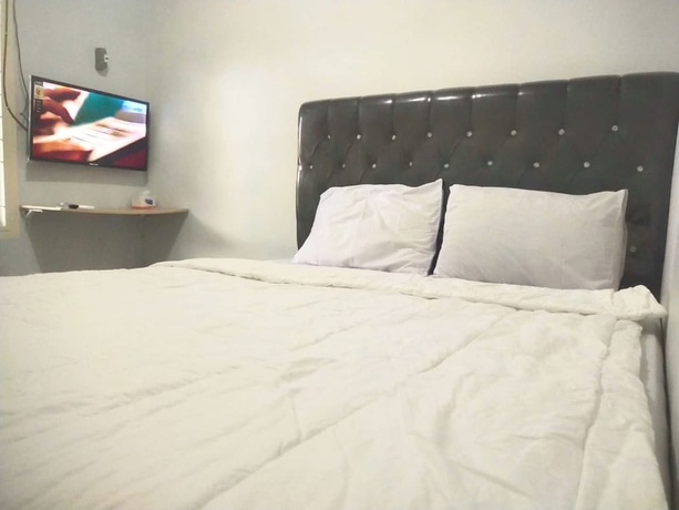 Imagen de la habitación del Hotel OYO 93630 Wongso Residence Syariah. Foto 2