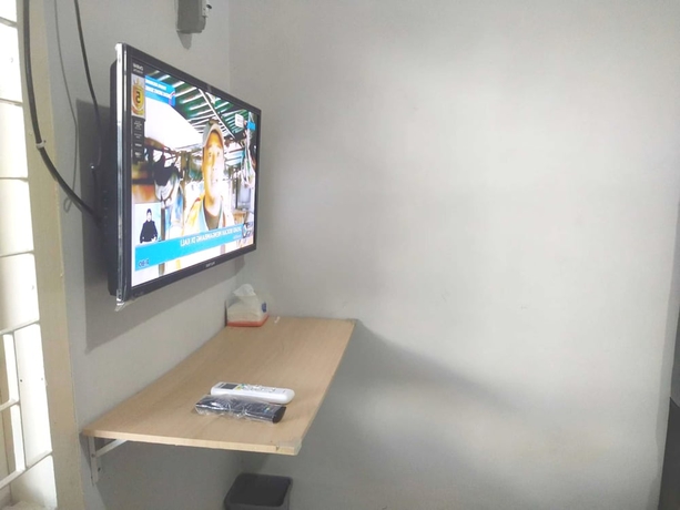 Imagen de la habitación del Hotel OYO 93630 Wongso Residence Syariah. Foto 4