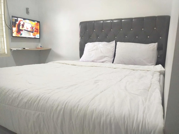 Imagen de la habitación del Hotel OYO 93630 Wongso Residence Syariah. Foto 5