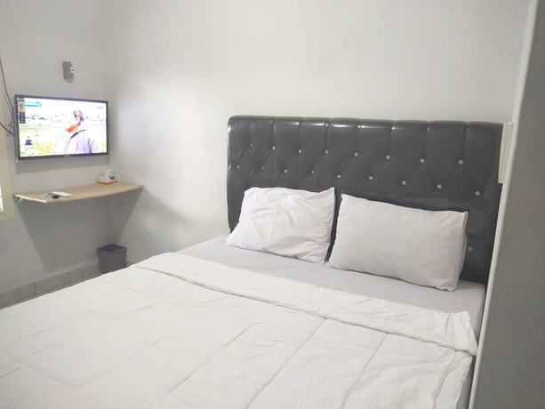 Imagen de la habitación del Hotel OYO 93630 Wongso Residence Syariah. Foto 6