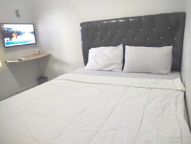 Imagen de la habitación del Hotel OYO 93630 Wongso Residence Syariah. Foto 7