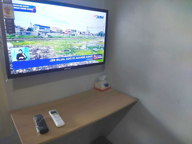 Imagen de la habitación del Hotel OYO 93630 Wongso Residence Syariah. Foto 10