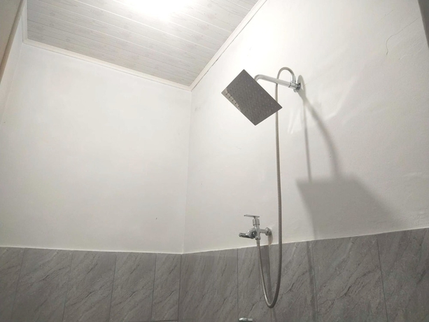 Imagen de la habitación del Hotel OYO 93630 Wongso Residence Syariah. Foto 11