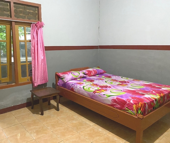 Imagen de la habitación del Hotel OYO 93632 Ramasta Homestay. Foto 4