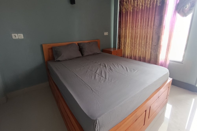 Imagen de la habitación del Hotel OYO 93638 Lotus Guest House. Foto 7